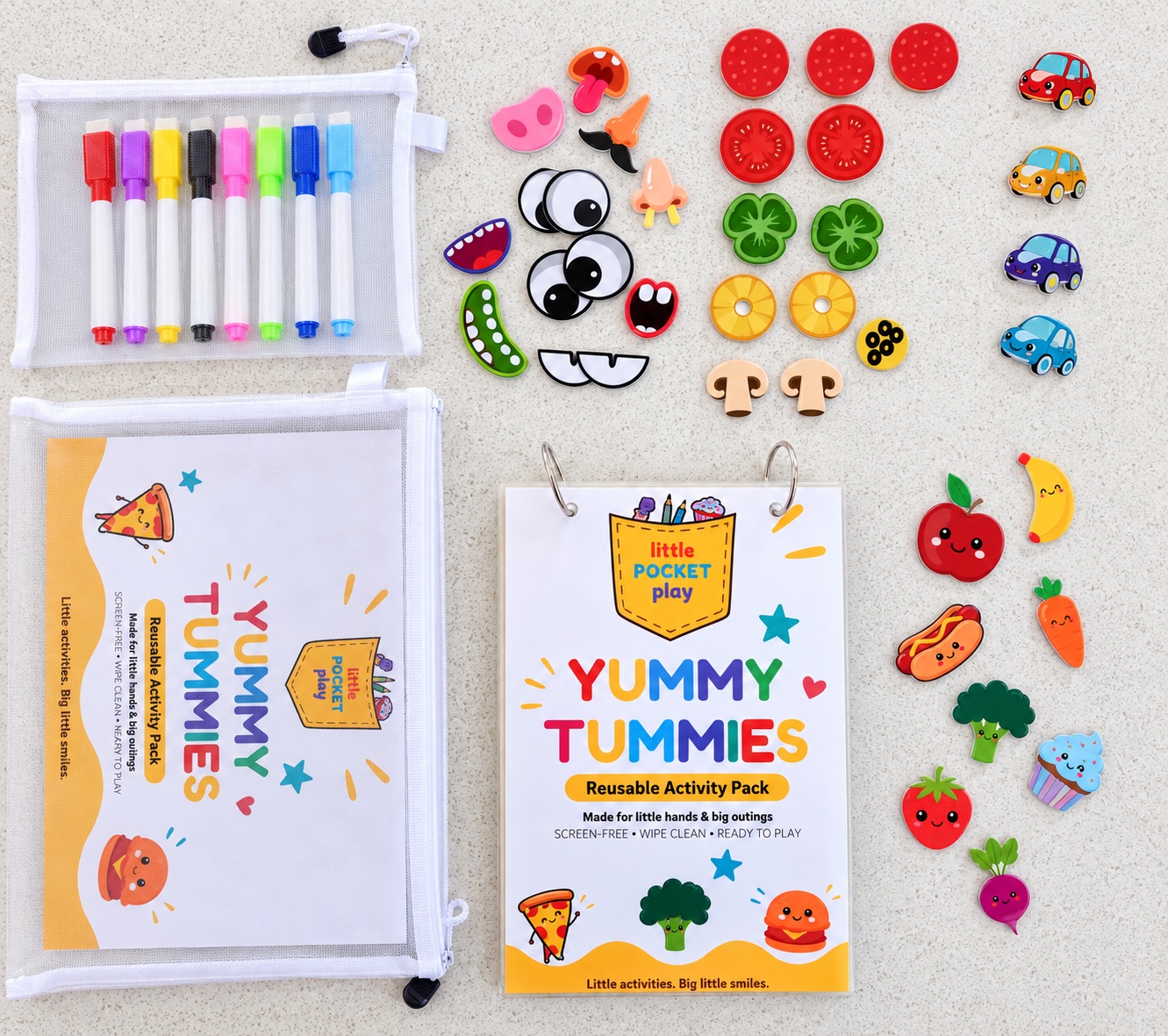 Yummy Tummies activity book, markers and play pieces laid out